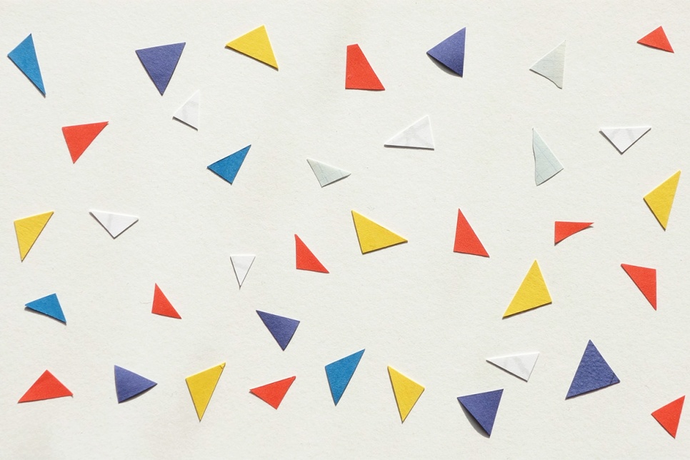 White background with colourful paper aeroplanes