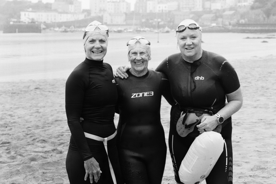 Nicola, Ann and Karen photographed after there early morning swim in front of Tenby Harbour.