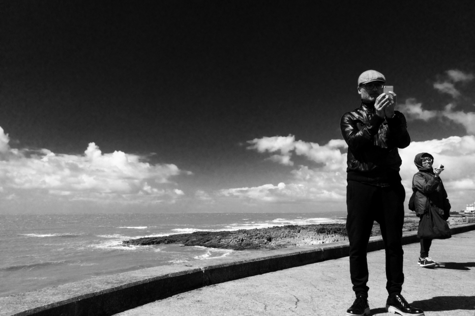 South Wales coastline with two figures taking photographs