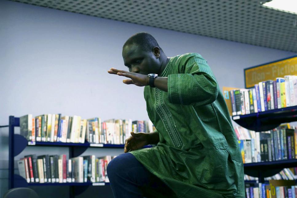 Man performing a dance at the Library