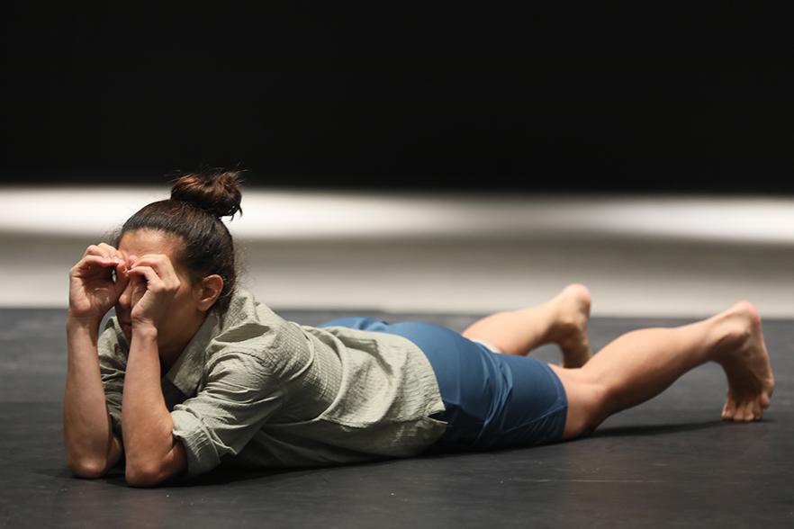 Dancer lying on a stage