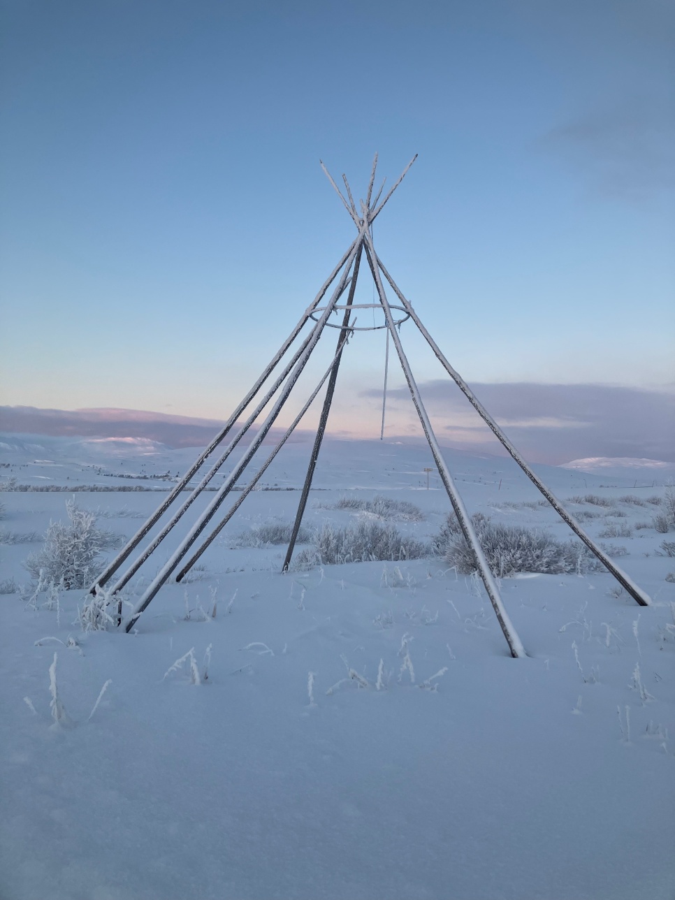Siri Wigdel - 'Govledh’ A tent structure of sticks and twine in the snow