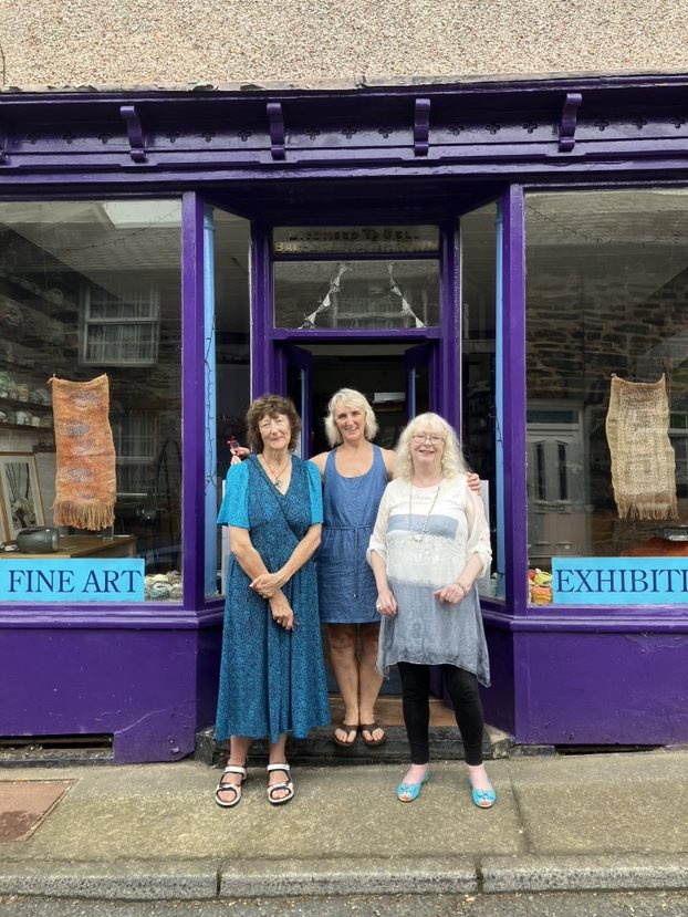 Credit: Veronica Calarco Three women stood in the doorway of a shop painted purple
