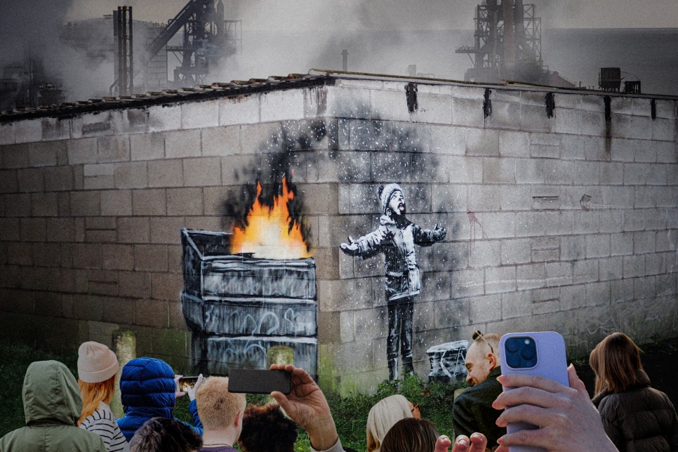 Photograph of Banksy mural with people looking on / Ffotograff o furlun Banksy gyda phobl yn edrych arno